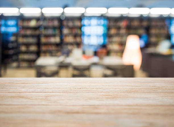istock Table top with blurred Book Shelf in Bookstore 475177872