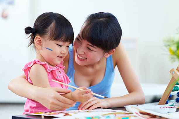 istock lovely little asian kid learning painting 475181224