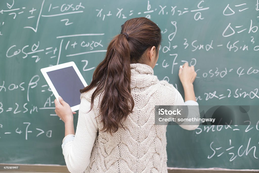 College students to write formulas on the blackboard 20-29 Years Stock Photo