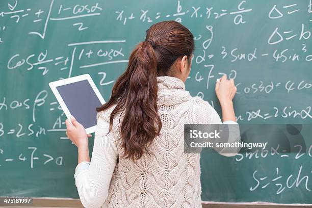 College Students To Write Formulas On The Blackboard Stock Photo - Download Image Now