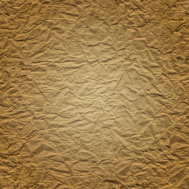 istock Bronze crumpled paper with visible paper collapse 475182630
