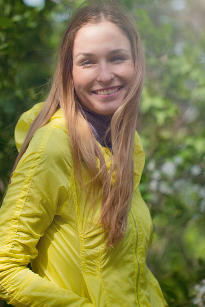 istock smiling girl against green park. 475182802