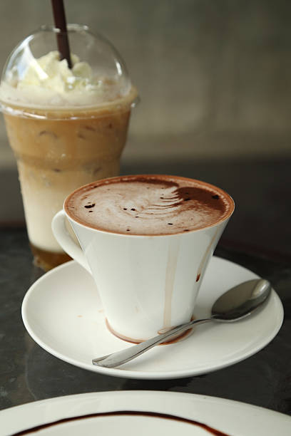 istock cup of hot chocolate with ice coffee 475182914