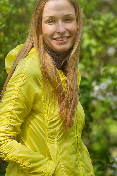 istock smiling girl against green park. 475183360