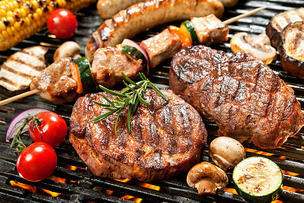 Grill Assorted delicious grilled meat with vegetable over the coals on a barbecue grilled stock pictures, royalty-free photos & images