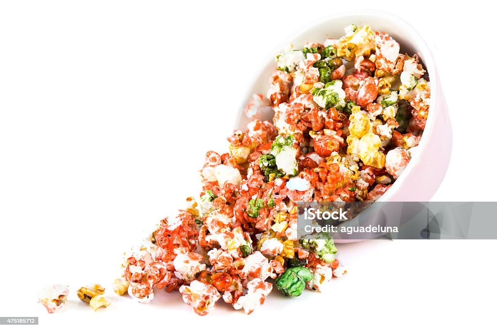 Spilling colorful sweet popcorn Spilling colorful sweet popcorn isolated on white background 2015 Stock Photo