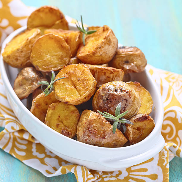 istock Oven baked potatoes with rosemary 475186164