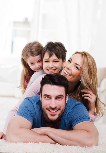 istock Family making pyramid at home 475187061