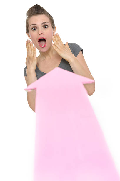 istock Big arrow pointing on scared business woman 475187794