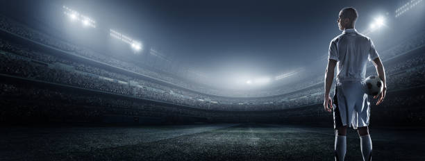 istock Soccer player with ball in stadium 475188818