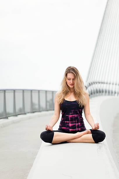 istock Resting and meditating in yoga position on the bridge 475189430