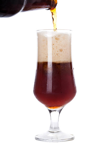 istock Pouring dark beer into a glass 475190129