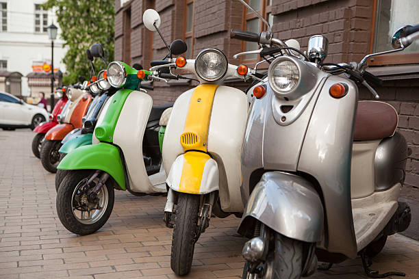 istock Row of mopeds on a street 475194358