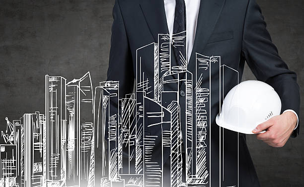 istock businessman with helmet 475195080