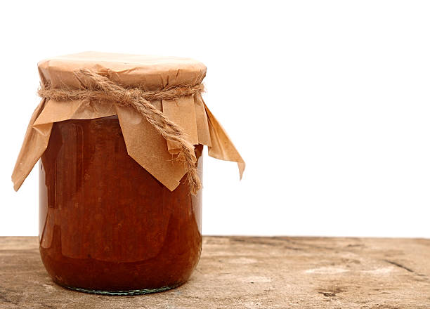istock apple jam in a glass jar on white 475197137