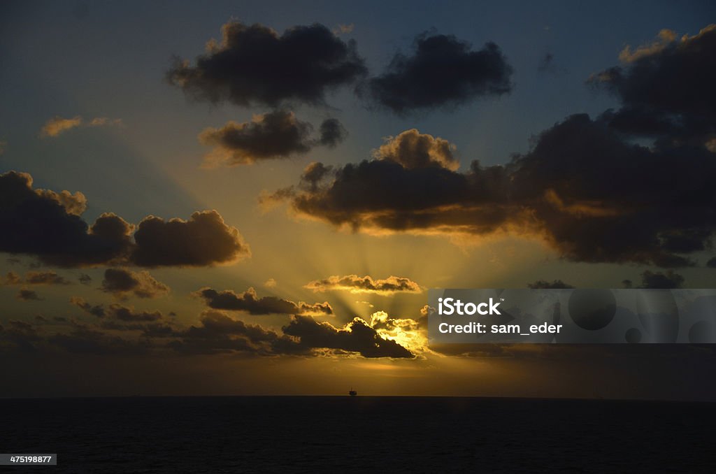 glowing sunset on sea with ship glowing sunset on sea with ship on horizon Backgrounds Stock Photo