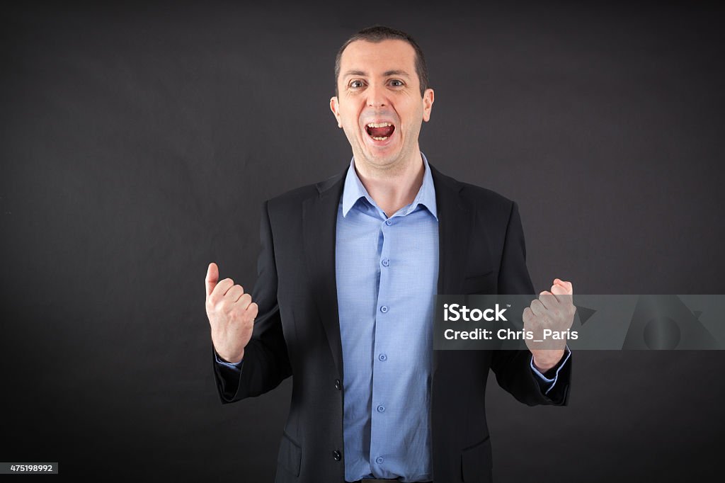 Handsome man doing different expressions in different sets of clothes Handsome man doing different expressions in different sets of clothes: arms raised 2015 Stock Photo