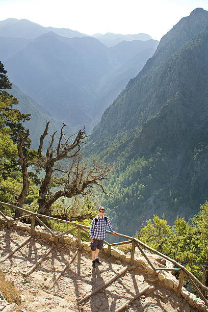 istock Young man hiking in beautiful mountains 475199587