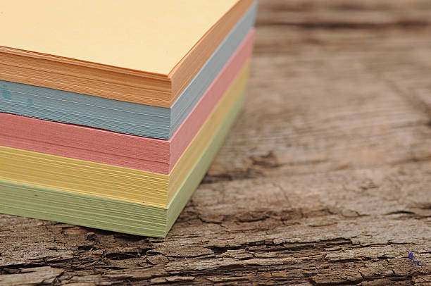 istock block of post-it notes on old wooden background 475200285
