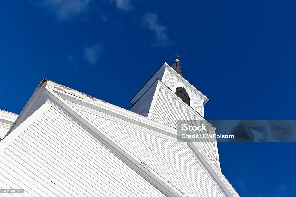 Old church Angle view of an old church with blue sky and wispy clouds. Church Stock Photo