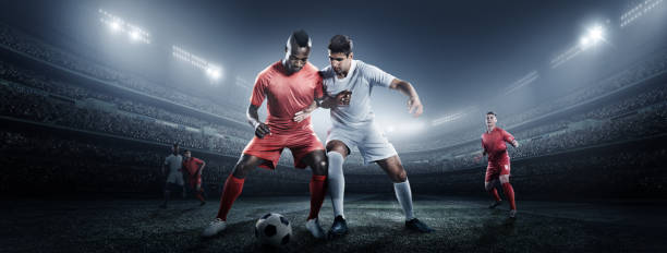 istock Soccer player kicking ball in stadium 475201264