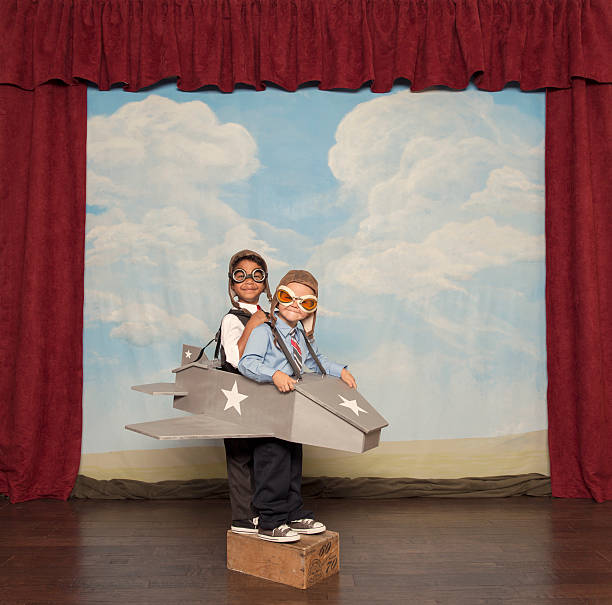 istock Young Boys and Pilots Flying Toy Plane 475201827