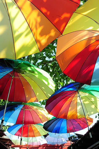 istock Street decorated with colored umbrellas 475203790