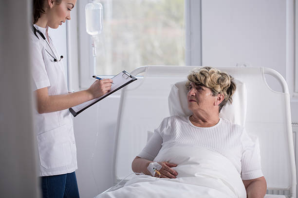 istock Geriatrician talking with senior woman 475204124