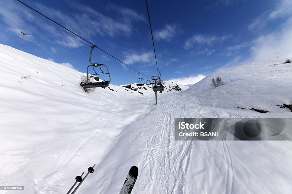 Chair-lift at ski resort Chair-lift at ski resort. Caucasus Mountains, Georgia, ski resort Gudauri. Wide-angle view. 2015 Stock Photo