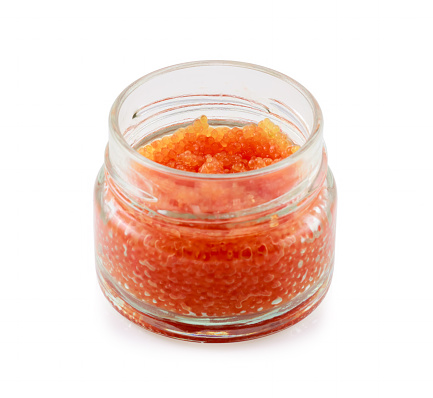 Red caviar from a lumpsucker or lumpfish (Cyclopterus lumpus) in a glass jar isolated on white