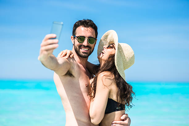 istock Happiness couple at the seaside take a selfie 475204870