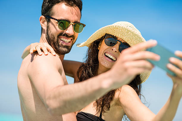 istock Happiness couple at the seaside take a selfie 475204878