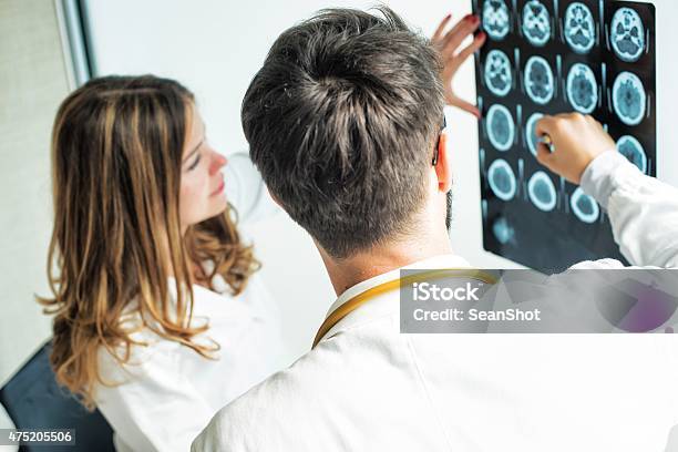 Doctors Examining Xray Stock Photo - Download Image Now - Human Nervous System, Doctor, X-ray Image