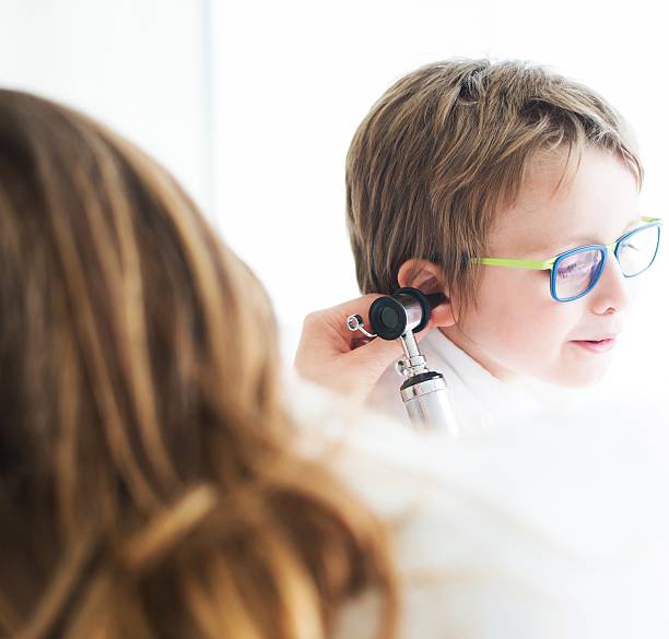 istock Female Doctor Visiting a Child 475205514