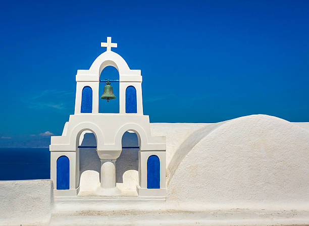 istock Chapel with the bell in against blue sky in Santorini 475209350