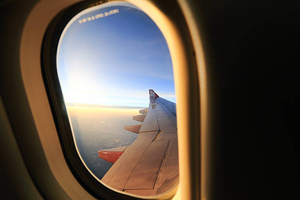 istock Window airplane Travel time is sunset. 475210031