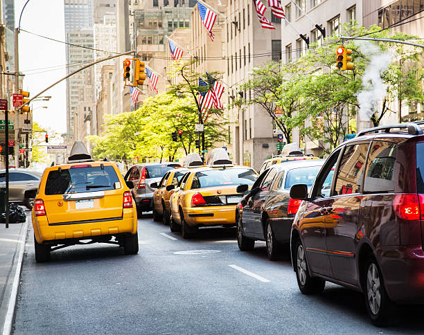 istock Cabs And Traffic In Manhattan, New York City 475210143