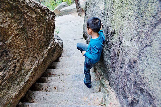 istock Little boy walking on stairs 475211328