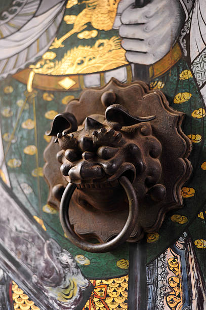 istock Chinese door with a lion hand door 475211518