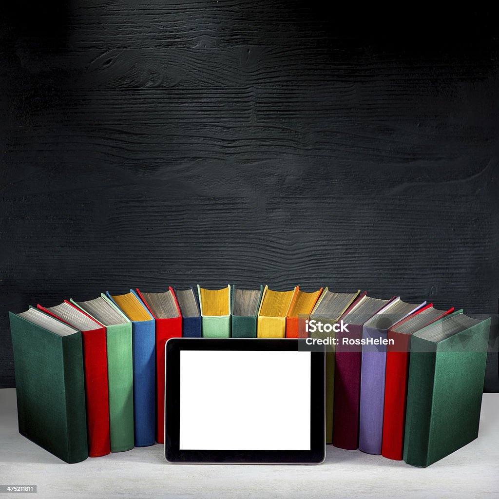 tablet with colorful books tablet with empty screen with colorful books on background with place for your text Digitization Stock Photo