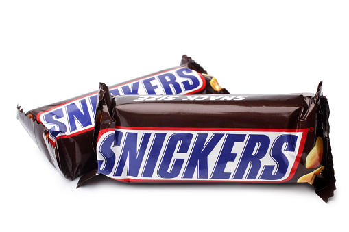 Saint-Petersburg, Russia - September 18, 2014: Photo of a Snickers candy chocolate bars on white background. Made by Mars, Incorporated