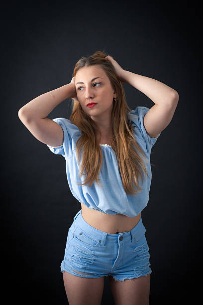 istock Beautiful girl doing different expressions in different sets of clothes 475214912