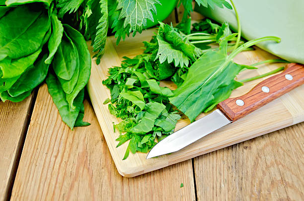 istock Sorrel and nettles sliced on the board with a knife 475216363