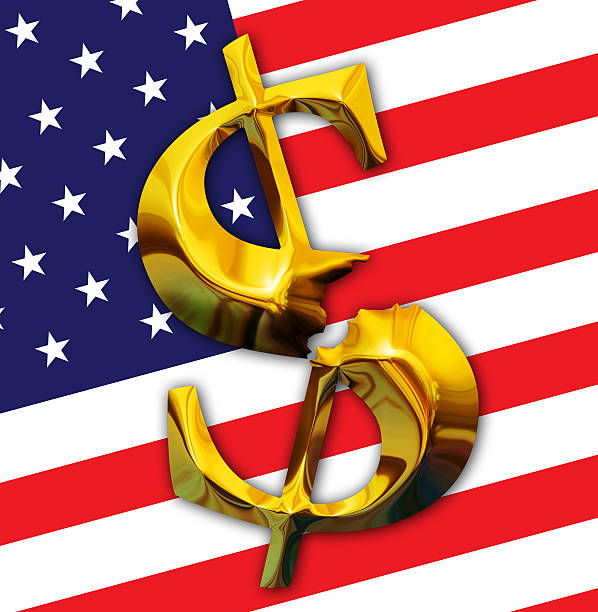 istock Broken gold dollar on American flag background 475217727