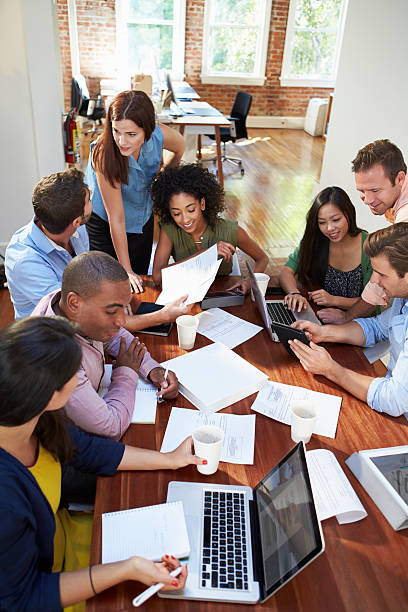 istock Group Of Office Workers Meeting To Discuss Ideas 475218581