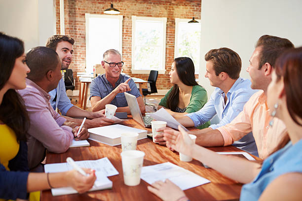 istock Group Of Office Workers Meeting To Discuss Ideas 475219159