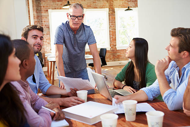 istock Group Of Office Workers Meeting To Discuss Ideas 475219251