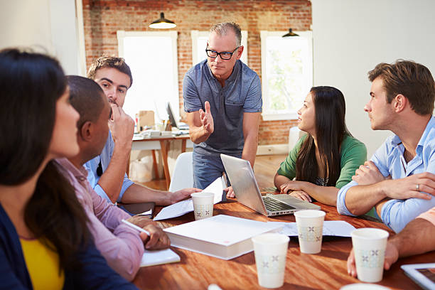 istock Group Of Office Workers Meeting To Discuss Ideas 475219315