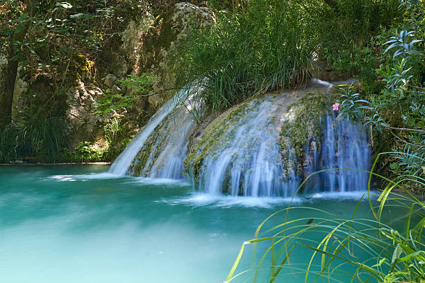 Natural waterfall and lake in Polilimnio area. Greece stock photo