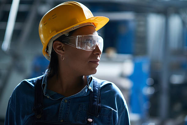 Best worker African woman finding strengths to finish work safety glasses stock pictures, royalty-free photos & images